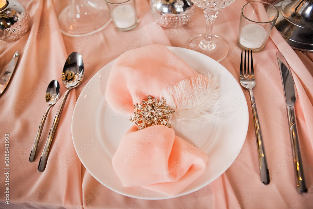 Wedding table setting with tablecloths, dishes and decorations. Wedding table setting with tablecloths, dishes and decorations.