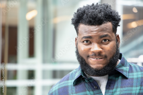 angry frustrated black African man with very serious emotion expression