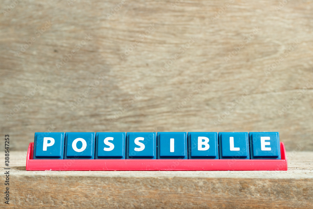 Fototapeta premium Tile letter on red rack in word possible on wood background