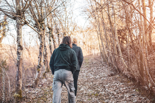 Couple walking in nature, recreational outdoor pursuit. © astrosystem