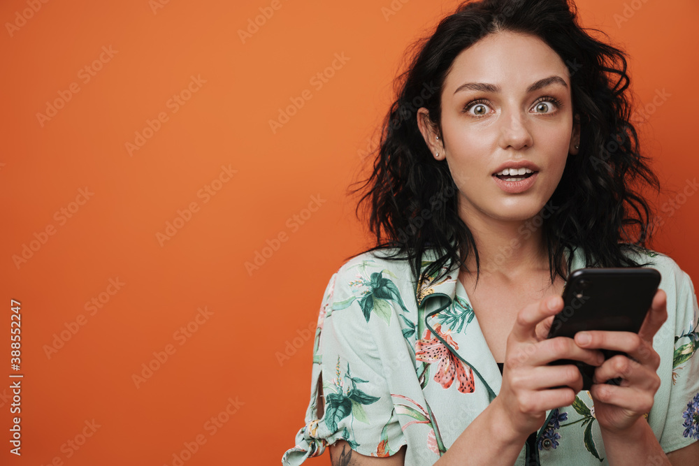Shocked woman using mobile phone Shocked woman using mobile phone