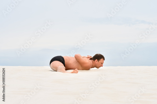 Man sitting on twine on the beach