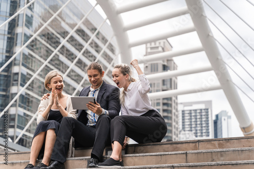 Business people with laptop computer discussion and work together at outdoor