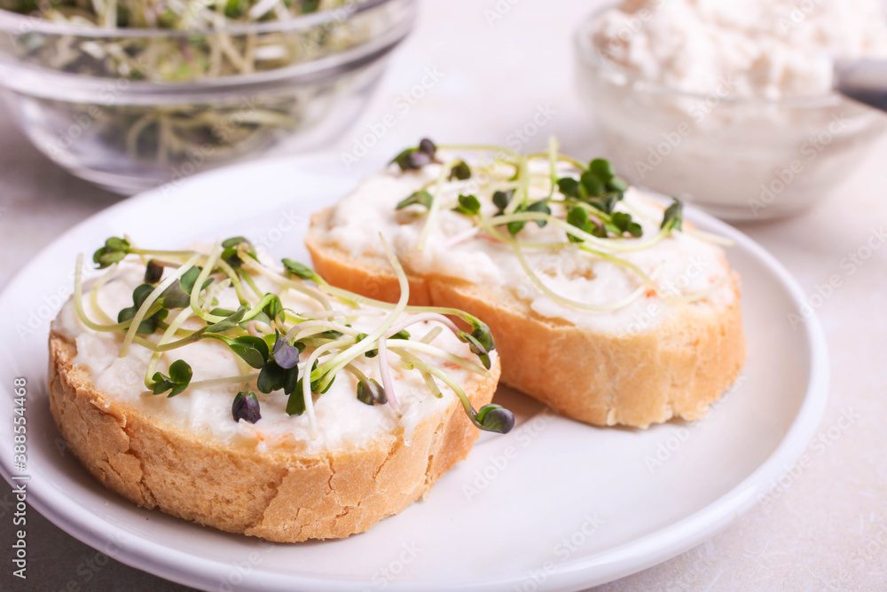 Toasts with cream and radish microgreen