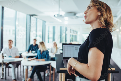 Business woman making a presentation to her colleagues