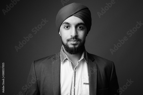 Fotografie, Obraz Young bearded Indian Sikh businessman wearing turban