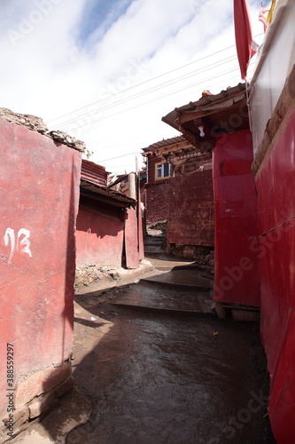 Close up of  red log cabins at The Serta Larung Five Science Buddhist Academy (Chinese: Seda Larong Wuming Buddhist  Academy) in Sertar county, Garze Tibetan Autonomous Prefecture, Sichuan, China.  photo