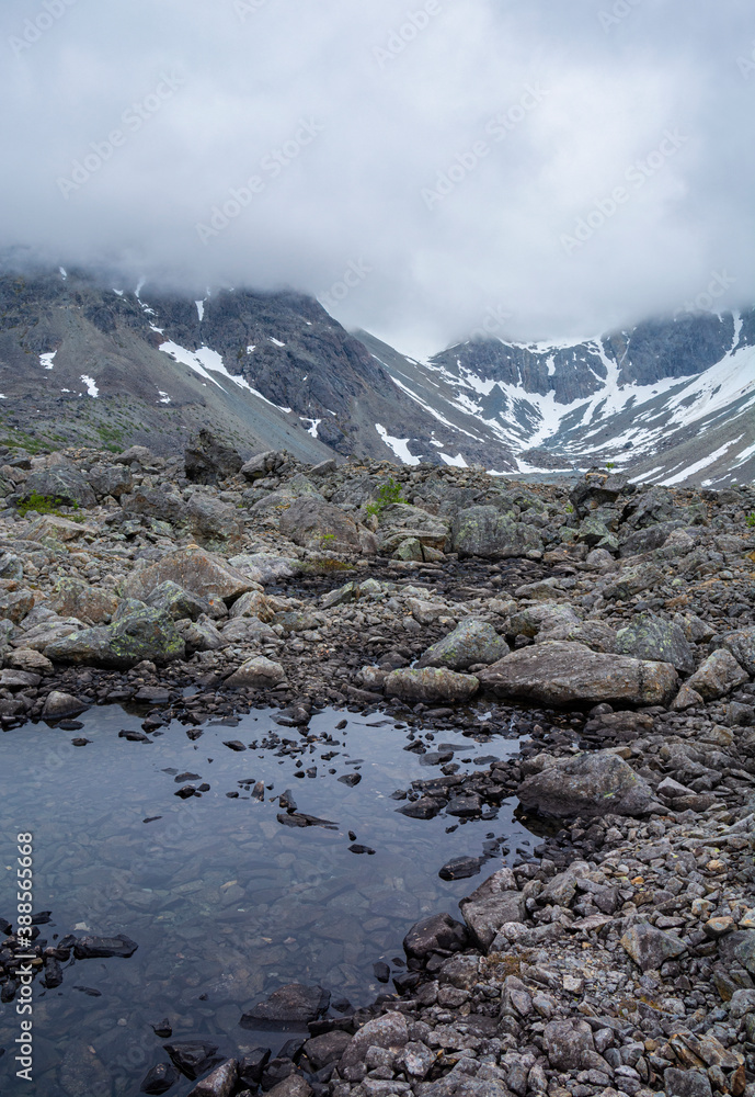 View of the area near The Lake Blavatnet, rocks and water, Lyngen Alps, Norway