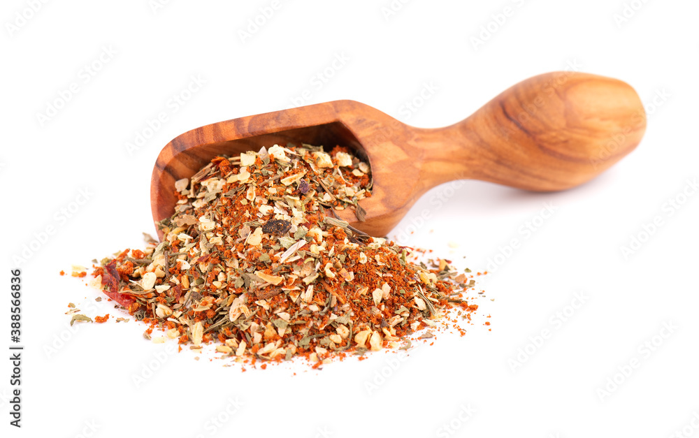 Mix of herbs, spices and dry tomatoes in wooden scoop, isolated on white background. Natural organic food seasoning. Mix of herbs, spices and dry tomatoes in wooden scoop, isolated on white background. Natural organic food seasoning.