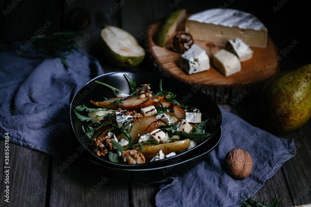 salad with pear nuts arugula and cheese