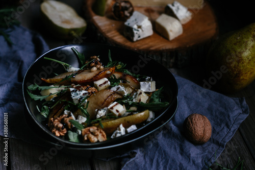 salad with pear nuts arugula and cheese