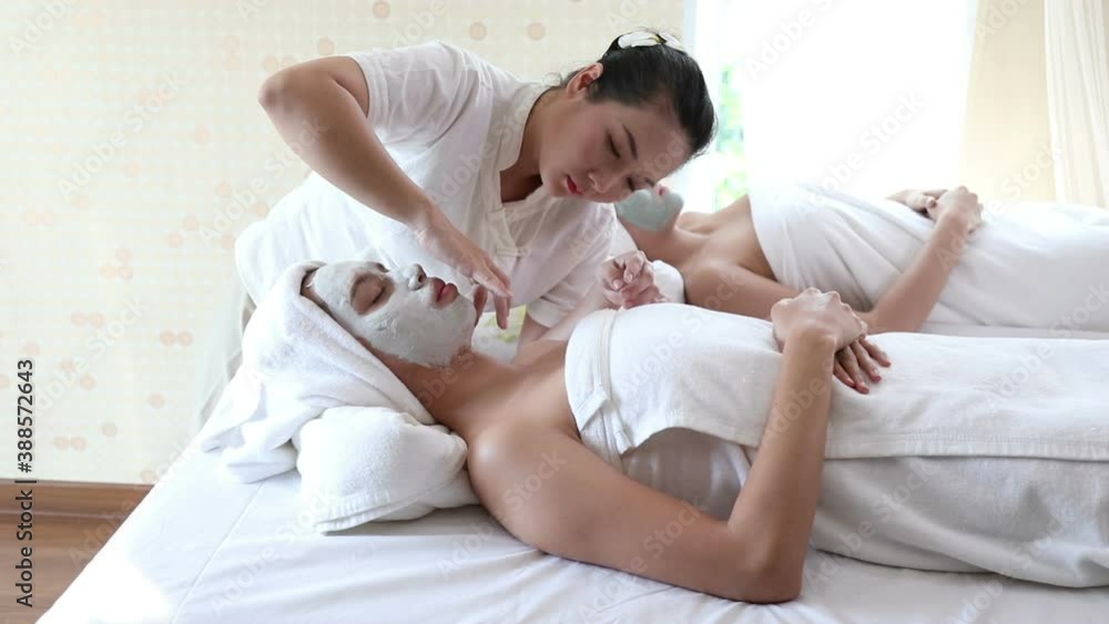 beautician use finger to rub facial mask on young Asian women shin after fill up, vdo by handheld beautician use finger to rub facial mask on young Asian women shin after fill up, vdo by handheld