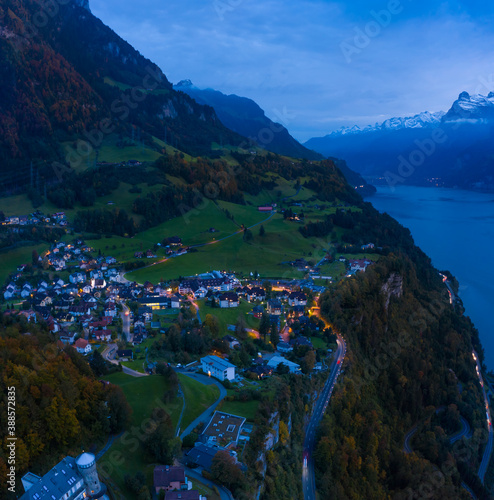 Night panorama of the canton Schwyz, Lake Lucerne. City Morschach. Night lights. Aerial view.