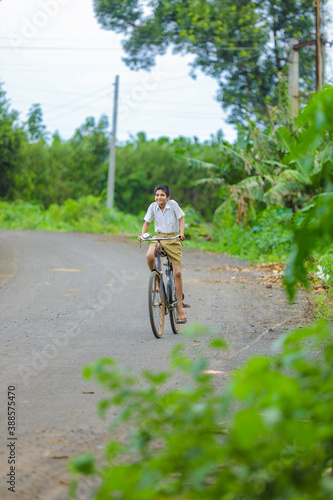 indian little boy enjoy cycle riding