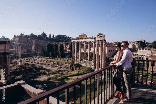 The love story of a guy and a girl on the city streets. Young people travel. Summer walk around the city.
