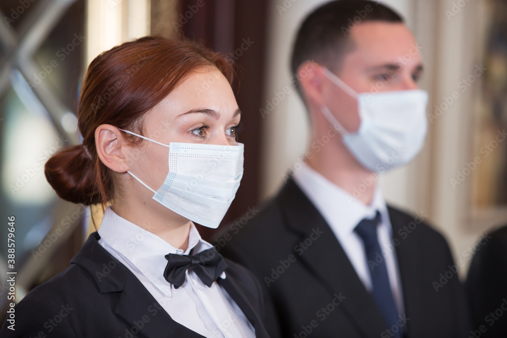the staff of an elite hotel serves guests the staff of an elite hotel serves guests