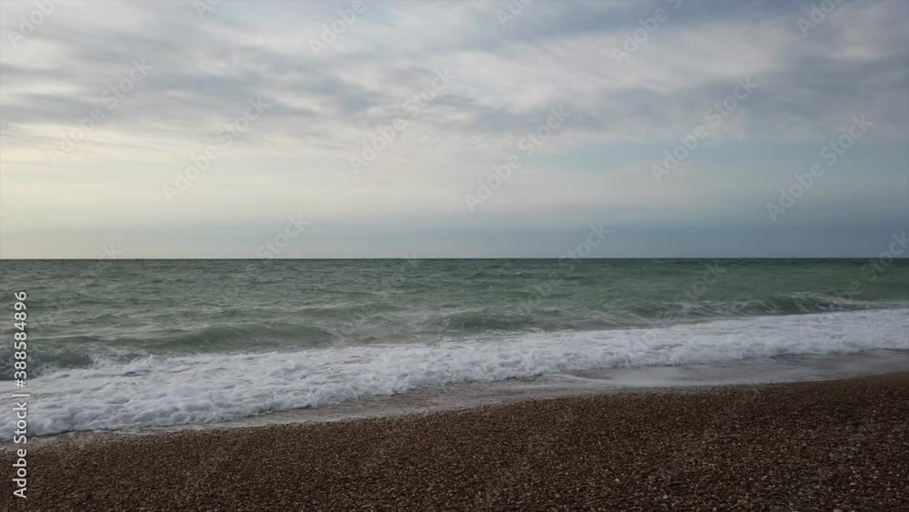 View from the beach to the stormy sea in September. View from the beach to the stormy sea in September.