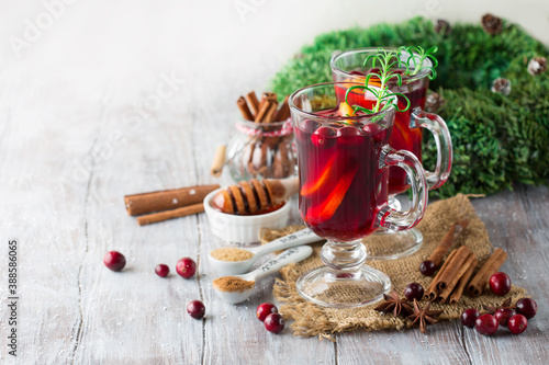 Christmas Hot mulled wine in glasses with orange slices, cranberries.