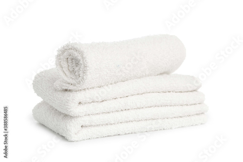 several white beach cotton towels folded on white background