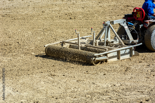Close up of a tractor preparing the Field before an Equestrian competition in Italy