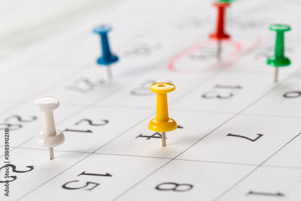 Push pins on calendar. Idea concept of to do planning. Push pins on calendar. Idea concept of to do planning.