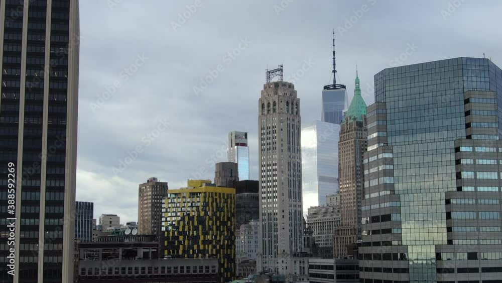 Tilted up brief slow aerial of freedom tower: gloomy, cloudy day Tilted up brief slow aerial of freedom tower: gloomy, cloudy day
