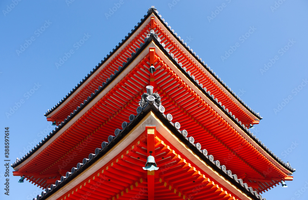 A detail of a tower at the red colored Nishimon Temple at Kiyomizudera Temple in Kyoto in Japan