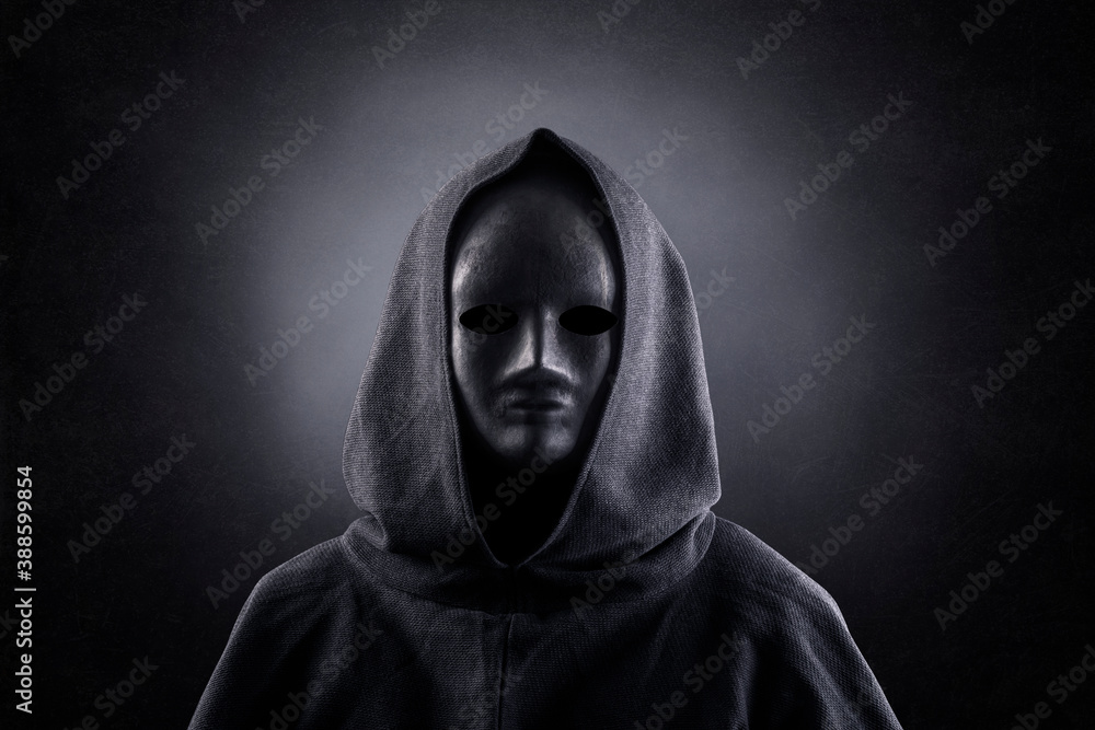 Portrait of a scary figure in hooded cloak Portrait of a scary figure in hooded cloak