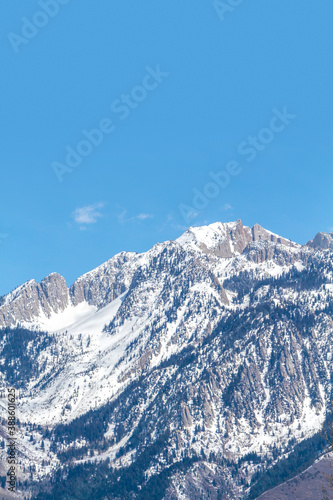 The Wasatch (Uinta) mountain range located along the east side of the Salt Lake valley (Utah). This peak is called Lone Peak.