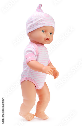 Fotografia, Obraz Toy baby doll in pink clothes and hat on white.