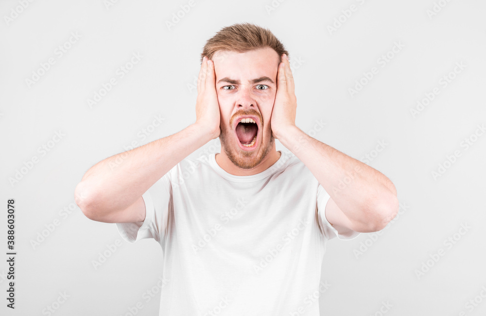 Portrait of young screaming guy , isolated on white studio background. Portrait of young screaming guy , isolated on white studio background.