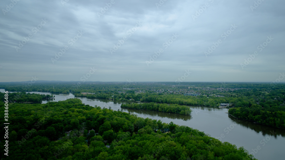Aerial view of the Mille Iles river on a cloudy summer day with grey clouds Aerial view of the Mille Iles river on a cloudy summer day with grey clouds