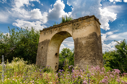 A beautiful arch under the open sky on the territory of the castle.. © Sergii