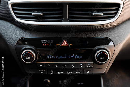 Interior view of a modern new car. Climatronic or air conditioner system. © mathefoto