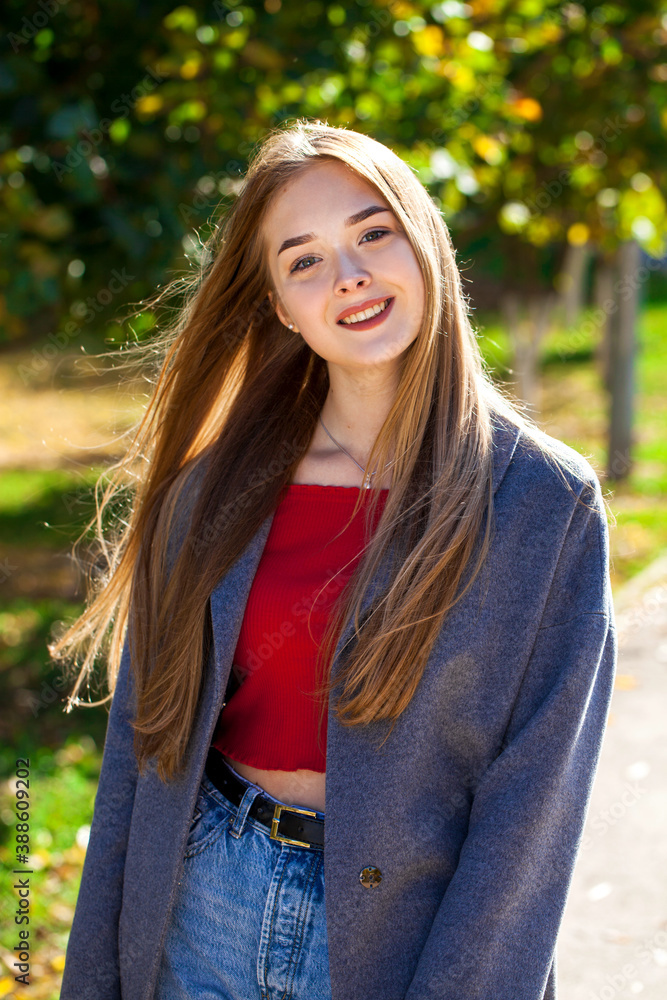 Portrait of a young beautiful blonde woman in gray coat Portrait of a young beautiful blonde woman in gray coat