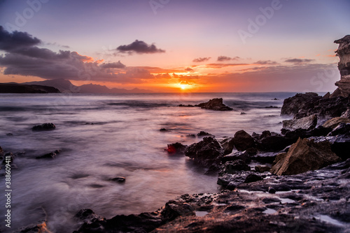 Waves and sunset at the coastline of Fuerteventura