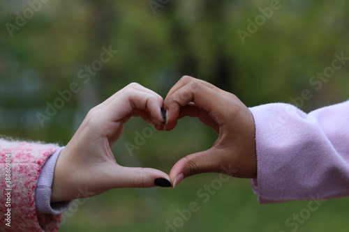 black and white hand together