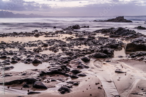 Fototapeta Naklejka Na Ścianę i Meble -  Waves and sunset at the coastline of Fuerteventura