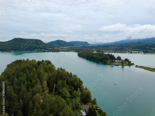 Aerial view on Lake 'Faaker See' in Carinthia (Kaernten), Austria with its famous turquoise water on a cloudy summer day