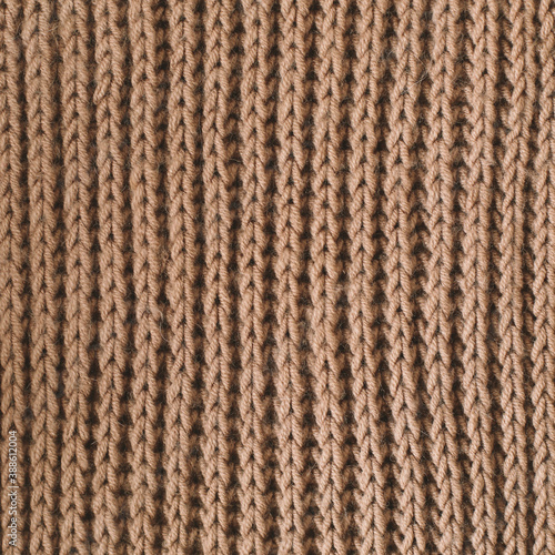 Knitted texture background. Knitting pattern of wool. Knitting. Texture of woolen fabric for wallpaper and abstract background.
