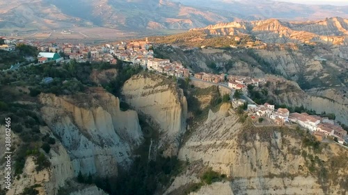 view of Aliano, a town in the province of Matera, in the Southern Italian region of Basilicata, Italy. Famous for the typical calanchi landscape. Aerial view photo