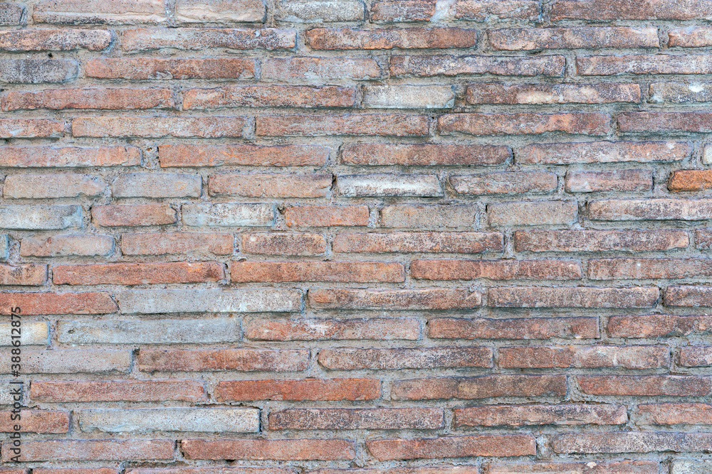 old brick wall of bricks of different sizes as background old brick wall of bricks of different sizes as background