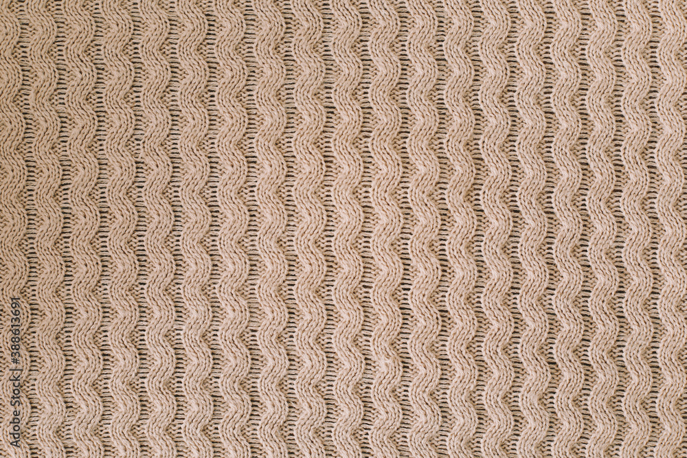 Knitted texture background. Knitting pattern of wool. Knitting. Texture of woolen fabric for wallpaper and abstract background. Knitted texture background. Knitting pattern of wool. Knitting. Texture of woolen fabric for wallpaper and abstract background.