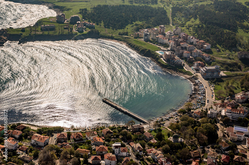 Town of Ahtopol from high above. Tandem motor paragliding over Black Sea shores near town of Ahtopol. Sunny autumn day, scenery colors and amazing landscapes and seascapes, Bulgaria photo