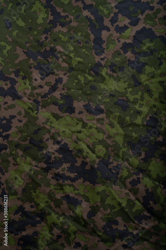A wrinkled camouflage cloth texture