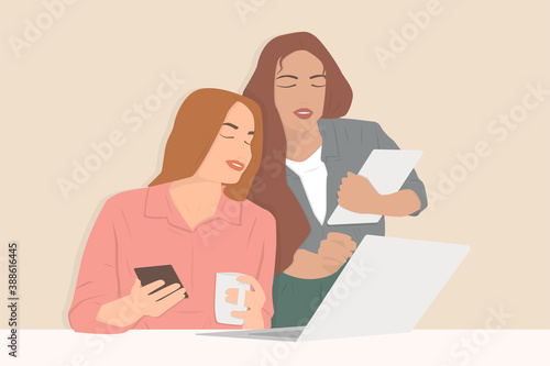 Two young girls working together on the project at the office