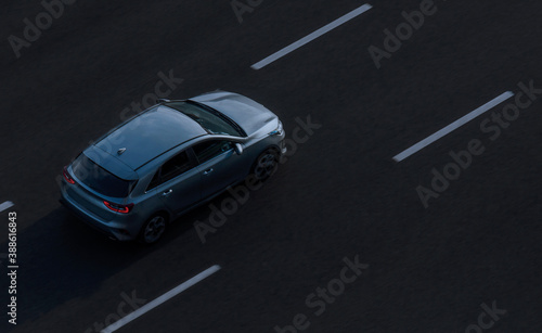 Saint Petersburg, Russia - July 25, 2020: Top view of one car on an empty road photographed from a height
