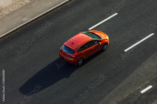 Saint Petersburg, Russia - July 25, 2020: Top view of one car on an empty road photographed from a height