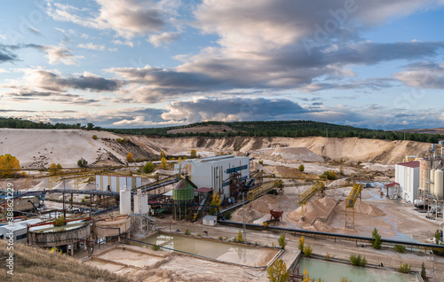 Industrial landscape of a silica sand open pit mine photo