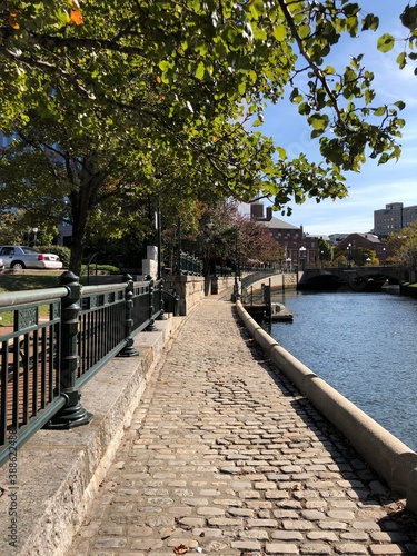 The Cobblestone Path along the Woonasquatucket River in Waterplace Park in Providence Rhode Island photo